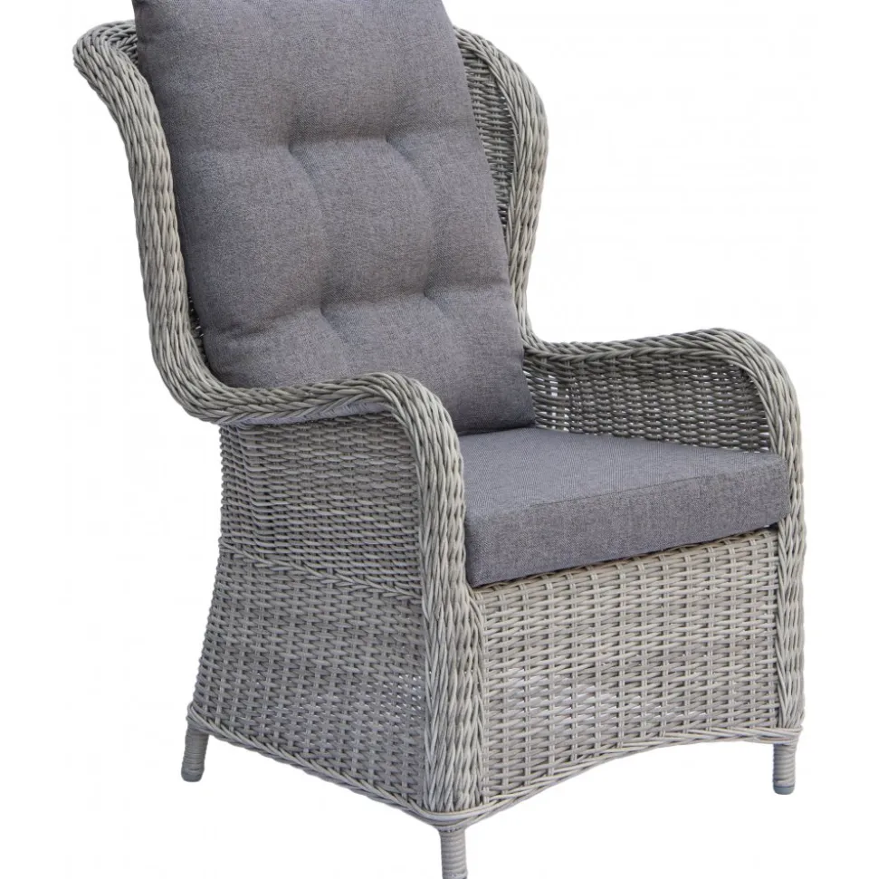 Fåtöljset med fotpallar och sidobord